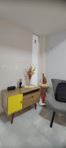 a living room with a desk and a chair at Casa Seridó - Caicó in Caicó