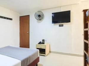 TV a/nebo společenská místnost v ubytování Hotel Colombia Avenida