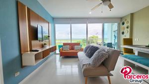 TV a/nebo společenská místnost v ubytování Regency Suites Morros by Parceros Group