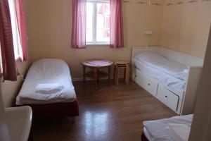 Postel nebo postele na pokoji v ubytování Sunne Hembygdsgård B&B