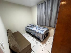 Ένα ή περισσότερα κρεβάτια σε δωμάτιο στο Apartamento Tenório dois quartos