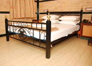 Postel nebo postele na pokoji v ubytování Hotel Hira