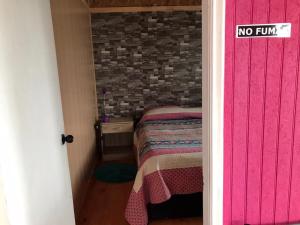 Postel nebo postele na pokoji v ubytování Cabaña Punta Nao 1 - Carretera Austral