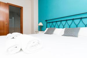 Posteľ alebo postele v izbe v ubytovaní Apartment Bright Sagrada Familia