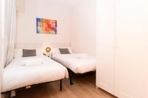 Posteľ alebo postele v izbe v ubytovaní Apartment Bright Sagrada Familia