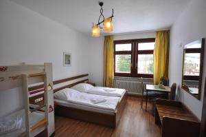 En eller flere senger på et rom på Hotel & Hostel Drei Bären