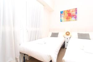 Posteľ alebo postele v izbe v ubytovaní Apartment Bright Sagrada Familia