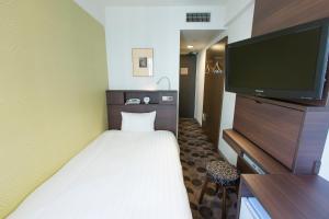 Cama o camas de una habitación en Shibuya Tobu Hotel