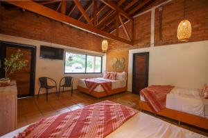 Postel nebo postele na pokoji v ubytování Tres Lagos Hotel