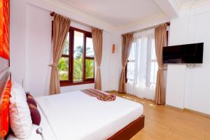 Televisyen dan/atau pusat hiburan di Ca Ty Mui ne Beach Resort & Spa +73 gambar