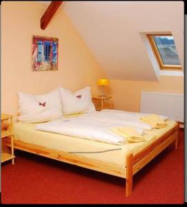 Postel nebo postele na pokoji v ubytování Penzion-Apex