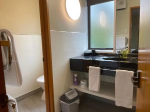 Koupelna v ubytování Allan Court Motel