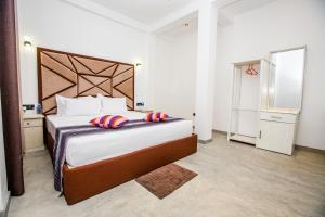 Ένα ή περισσότερα κρεβάτια σε δωμάτιο στο KUMA'S HOTEL