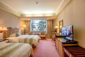 TV a/nebo společenská místnost v ubytování Panyu Hotel
