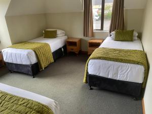 Postel nebo postele na pokoji v ubytování Allan Court Motel