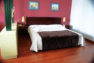 Cama o camas de una habitación en Hotel Puerto de Las Nieves