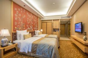 Letto o letti in una camera di Panyu Hotel