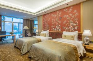 Letto o letti in una camera di Panyu Hotel