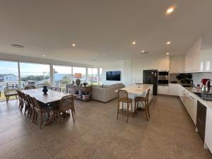a kitchen and dining room with a table and chairs at Middy's in Middleton