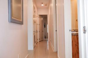 a hallway leading to a hallway with at La Isla C206 condo in South Padre Island +17 photos