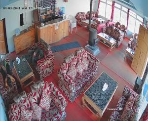 an overhead view of a living room with couches at everest view resort in Jantra Khāni