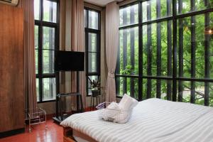 Ένα ή περισσότερα κρεβάτια σε δωμάτιο στο The Melatonin Hostel - จองห้อง ROOM