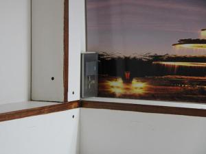 a window with a picture of a beach at Balai Balai Capsule Hotel Cebu in Cebu City