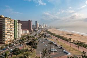 a view of a city with a beach and buildings at Shaka Shores 7E in Durban
