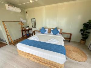 Postel nebo postele na pokoji v ubytování Naroth Beach Bungalow