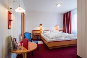 Gulta vai gultas numurā naktsmītnē Hotel Deutsches Haus