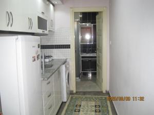 Kuchyň nebo kuchyňský kout v ubytování Bella Suit Apart Hotel