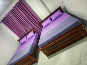 Giường trong phòng chung tại Onel Rest Inn