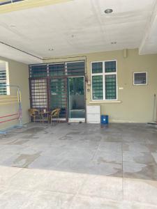 an empty room with chairs and a table and windows at D'sofia Homestay Jelebu 4 in Kuala Kelawang