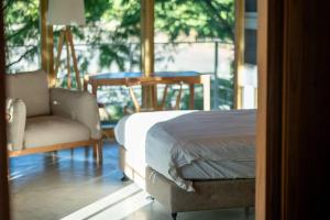 Postel nebo postele na pokoji v ubytování Chuying Sunrise B&B