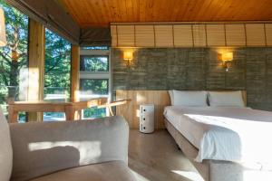 Postel nebo postele na pokoji v ubytování Chuying Sunrise B&B