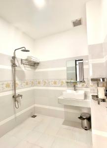 Koupelna v ubytování Hotel KAMI 1 + 23 fotografií