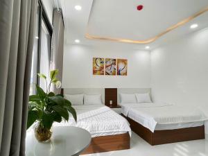 Postel nebo postele na pokoji v ubytování Hotel KAMI 1