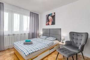 Posteľ alebo postele v izbe v ubytovaní Andersena 190 A - 12 piętro - 10 min CMKP - 5 min Metro - 15 min Centrum
