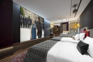 Voodi või voodid majutusasutuse Beso Designer Apartent Hotel toas