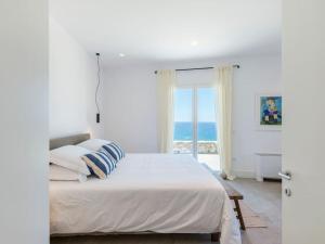 Postel nebo postele na pokoji v ubytování Templo y Mar IV by Mykonos Mood + 58 fotografií