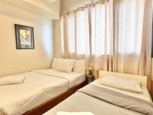 Postel nebo postele na pokoji v ubytování Modern 1 Bedroom Condo Unit with Pool view + 16 fotografií