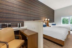 The Cranberry, Ascend Hotel Collection客房内的一张或多张床位