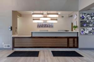 a lobby with a reception desk in a building at MainStay Suites Lebanon - Nashville Area in Lebanon