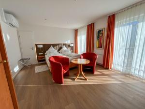 Postel nebo postele na pokoji v ubytování Akzent Hotel Atrium Baden