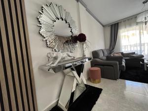 a living room with a mirror on the wall at Home S&F- Algorfa in Algorfa