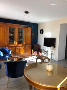 a living room with a table and chairs at La Vista Ultracentral - Private Parking in Craiova