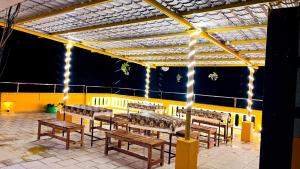 a group of benches in a room with lights at THE LUXE, ECR ROAD, NEAR Serenity Beach, Pondicherry - BMC in Pondicherry