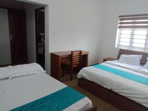 Postel nebo postele na pokoji v ubytování New Serene Mountains Munnar + 4 fotografie