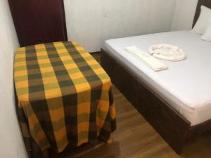 Postel nebo postele na pokoji v ubytování Hotel Parami
