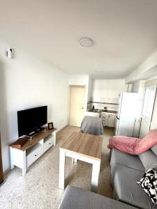 a living room with a couch and a coffee table at Casa Celia in El Bosque